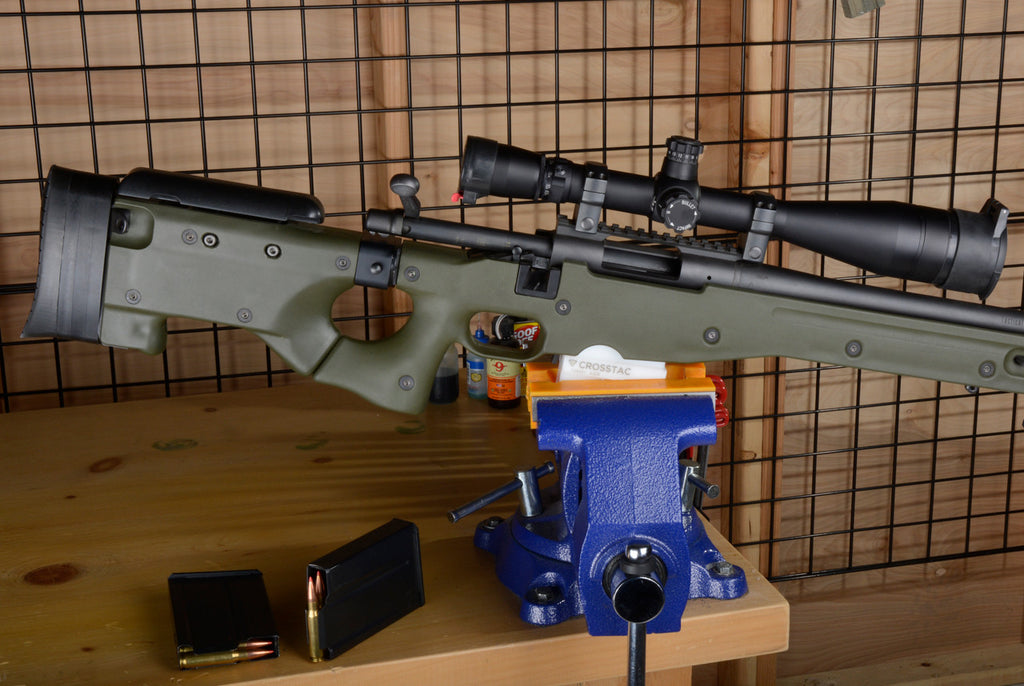 AICS Maintenance Block front view with rifle