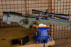 AICS Maintenance Block front view with rifle